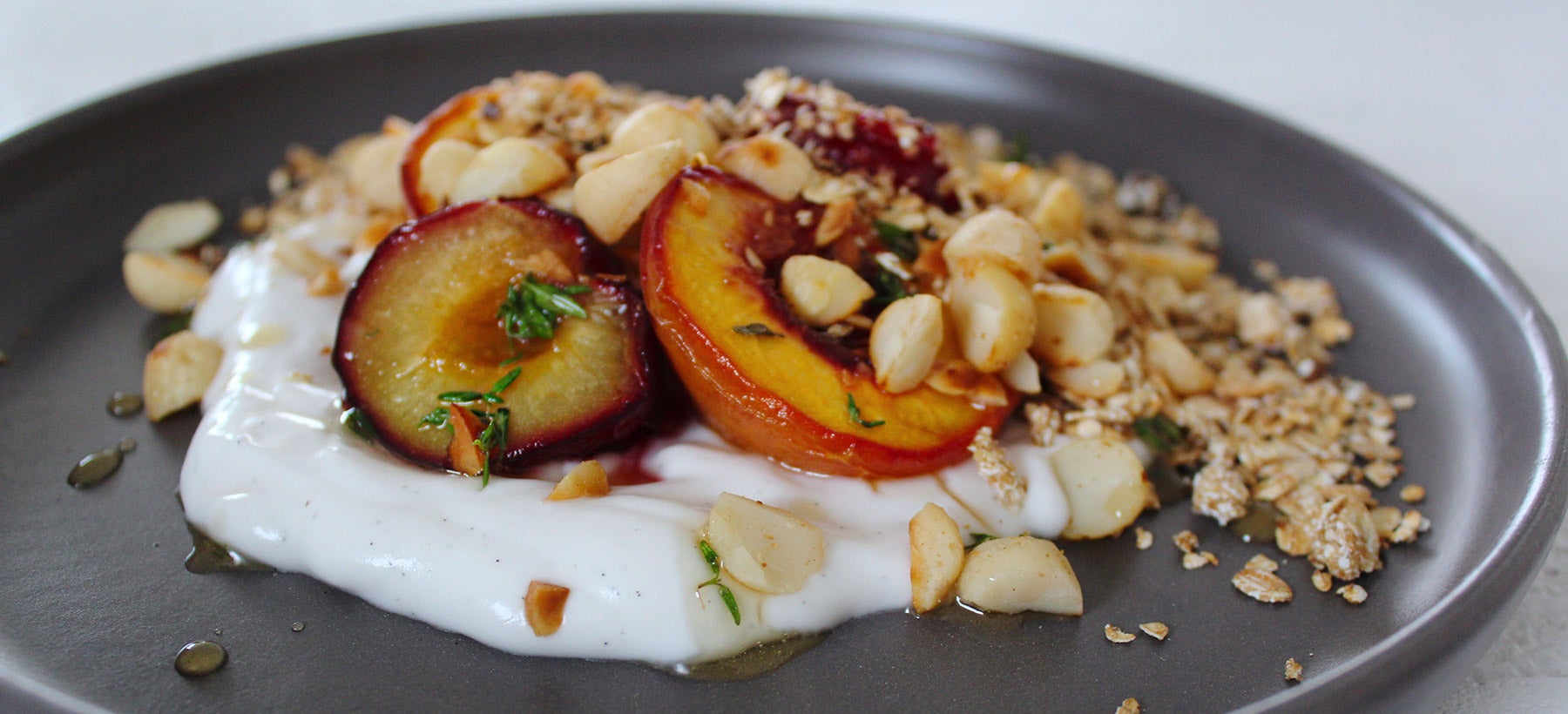 plate-of-yoghurt-grilled-peaches-nuts-and-oats