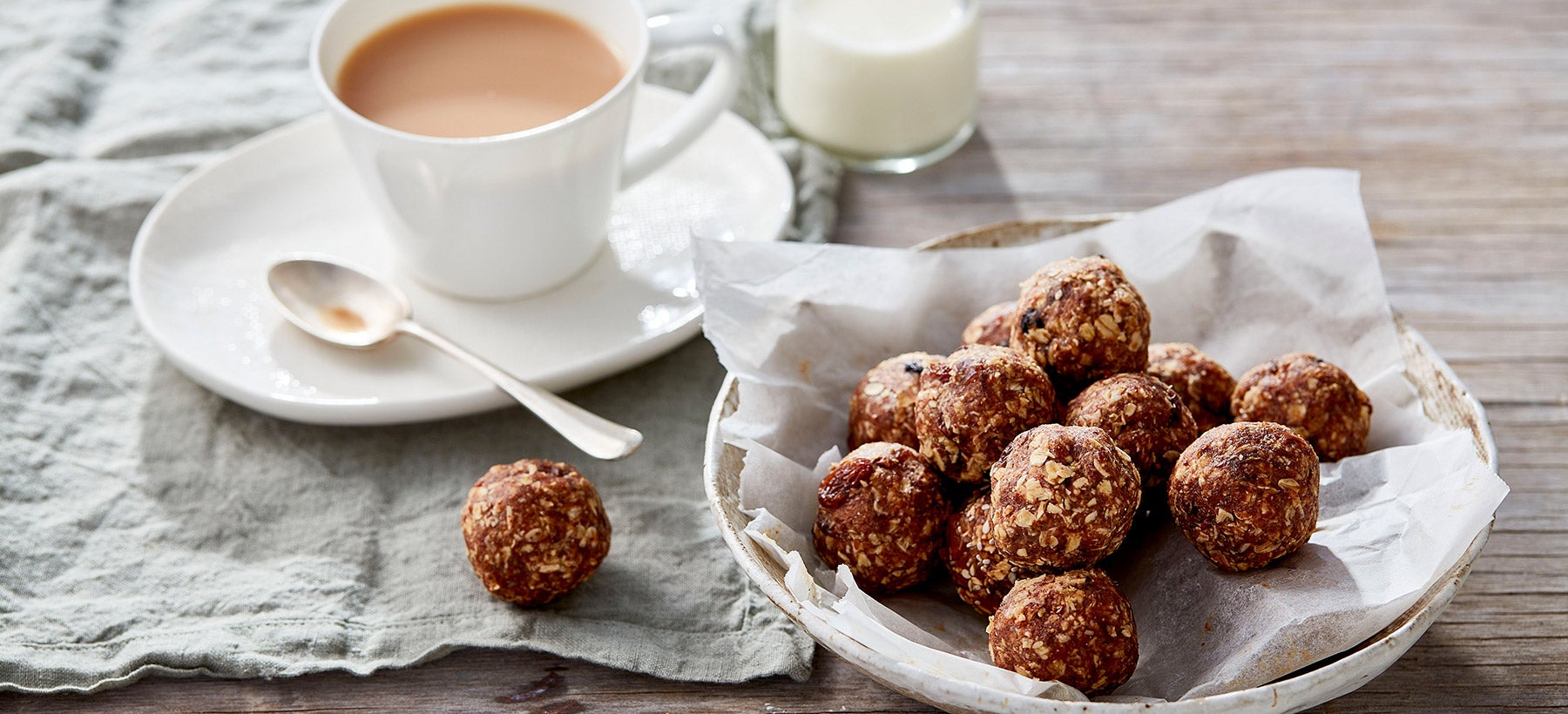 plate-of-oat-protein-balls-with-cup-of-tea
